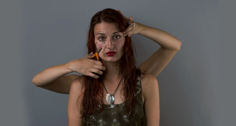 Woman with facial markings and extra arms holding scissors, symbolising inner conflict and distorted self-image linked to body dysmorphic disorder.