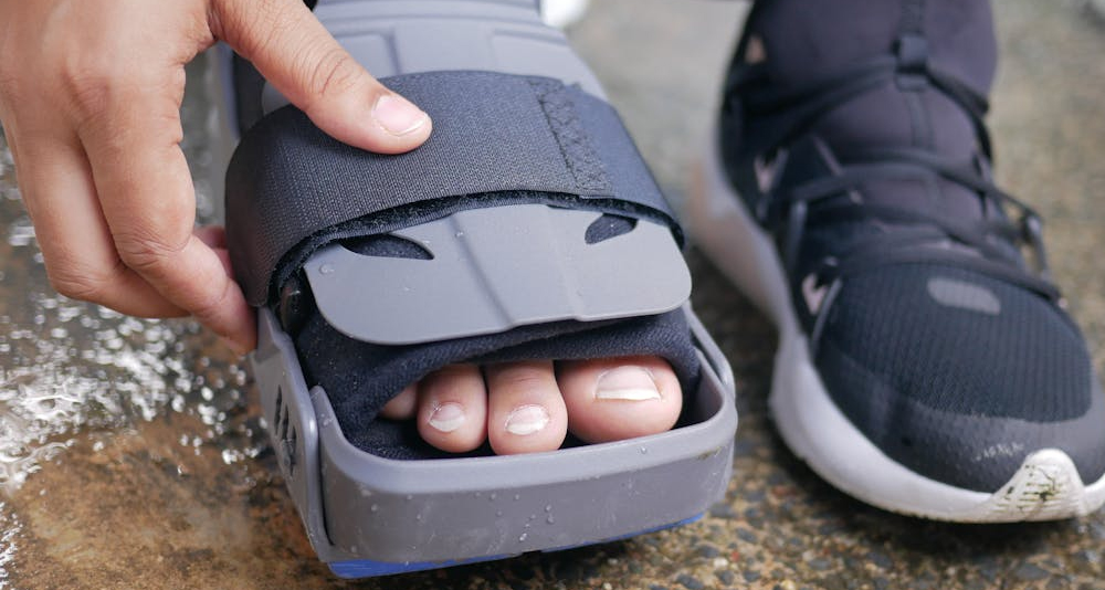 Close-up of foot in orthopaedic walking boot for broken toe recovery