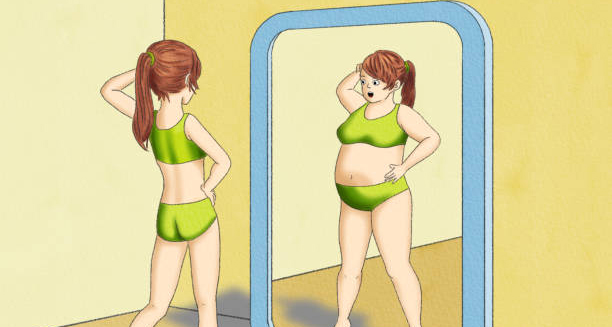 Slim girl viewing a distorted overweight reflection in a mirror