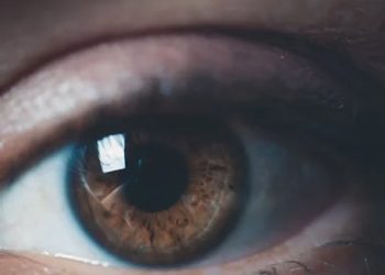 Close-up of a child's eye with natural brown iris