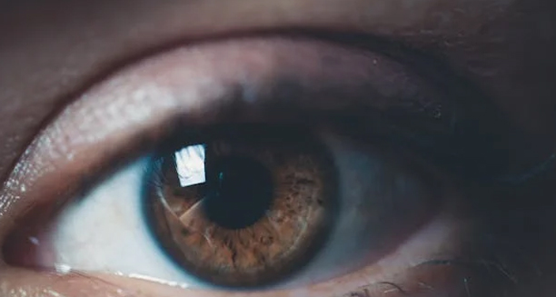 Close-up of a child's eye with natural brown iris