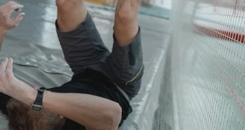 Man falling backwards, showing a common cause of hip fractures