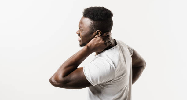 Man holding neck in pain due to cervical discomfort