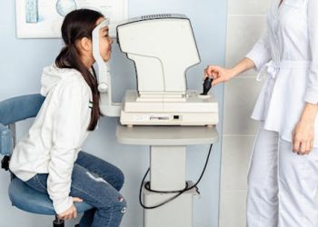 Child undergoing eye examination for cataracts