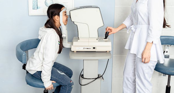 Child undergoing eye examination for cataracts