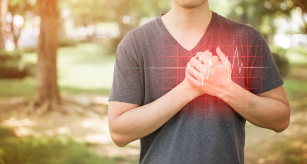 Man clutching chest with ECG line overlay indicating heart rhythm