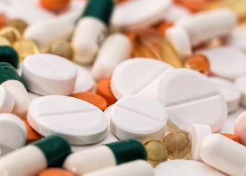 Assorted medication tablets and capsules used in pain management