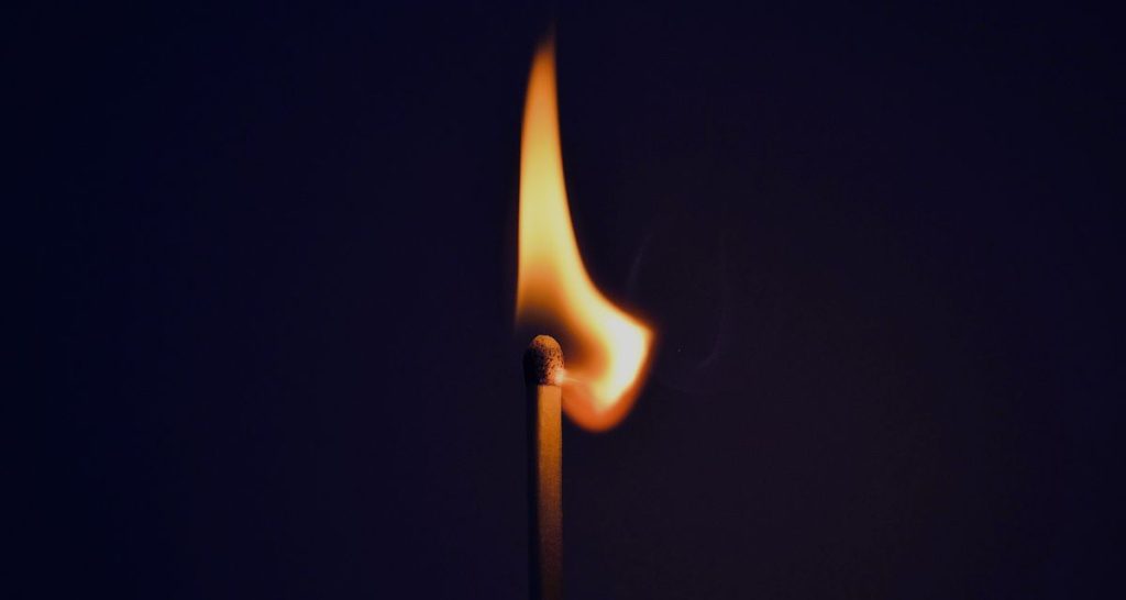 Burning matchstick symbolising mental and emotional burnout