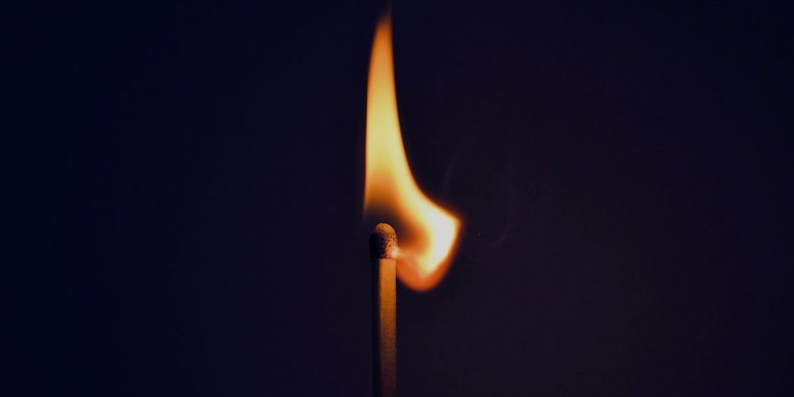 Burning matchstick symbolising mental and emotional burnout