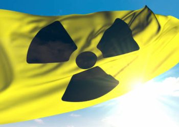 Radiation hazard symbol representing environmental exposure as a cause of chronic myeloid leukaemia.