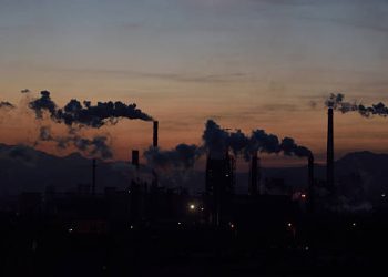 Industrial smoke polluting the air, contributing to causes of chronic obstructive pulmonary disease.