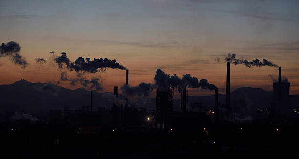Industrial smoke polluting the air, contributing to causes of chronic obstructive pulmonary disease.