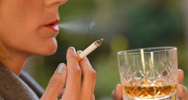 Person smoking excessively, potentially causing a cluster headache