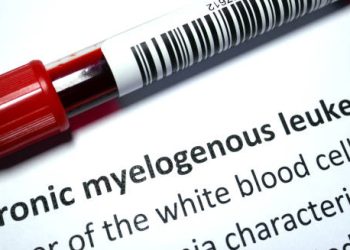 Yellow radiation warning flag symbolising environmental causes of chronic myeloid leukaemia.