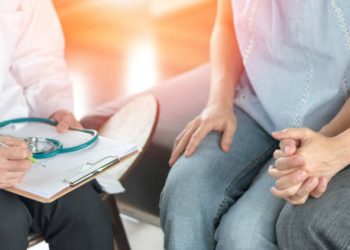 Doctor consulting a couple about chlamydia treatment