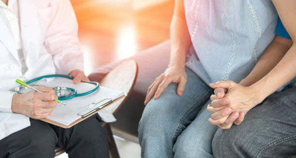 Doctor consulting a couple about chlamydia treatment