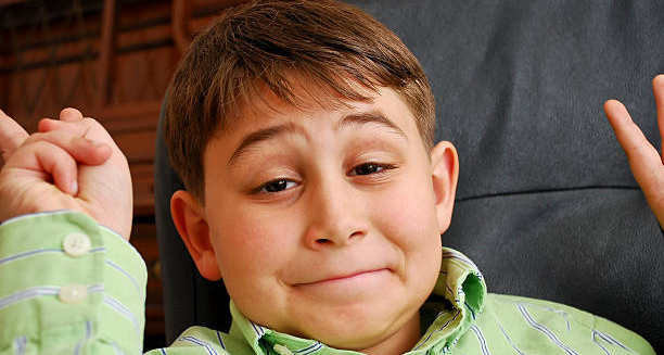 Child with DiGeorge syndrome raising hands