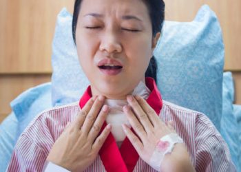 Woman recovering from a tracheostomy due to complications of epiglottitis