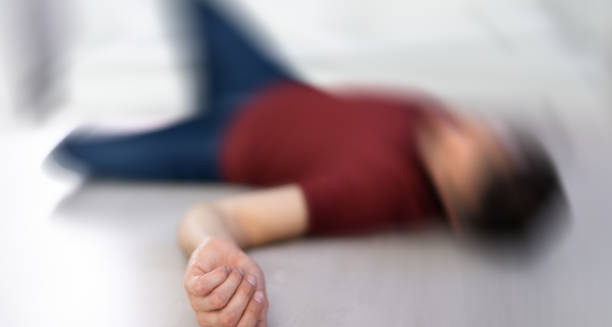 Blurred image of person lying unconscious after a seizure, illustrating epilepsy complications
