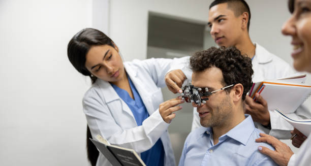 Optometrist performing colour vision test using specialised equipment