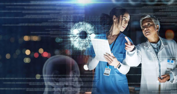 Doctors analysing eye cancer scan using digital imaging technology