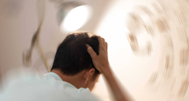 Man experiencing dizziness and confusion, common symptoms of chronic traumatic encephalopathy.