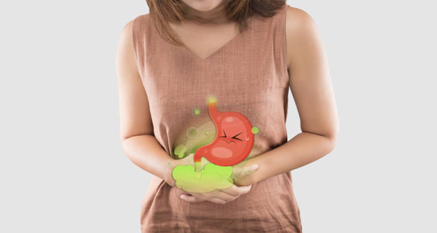 Woman holding stomach with illustrated inflamed gut indicating diarrhoea symptoms