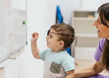 Child undergoing vision therapy with eye patch for cataract treatment