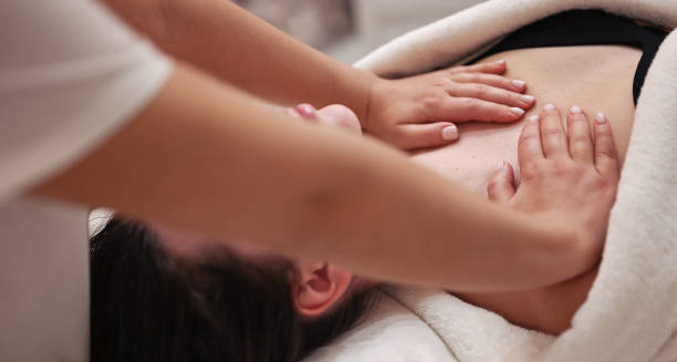 Chest physiotherapy being performed on a woman, a common treatment for cystic fibrosis.