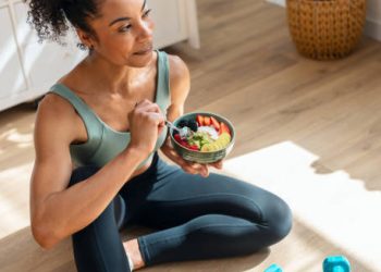 Woman eating healthy food after workout