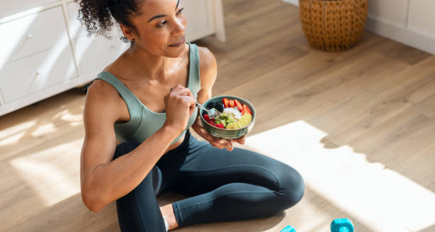 Woman eating healthy food after workout
