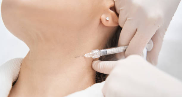 Close-up of a neck injection administered by a medical professional