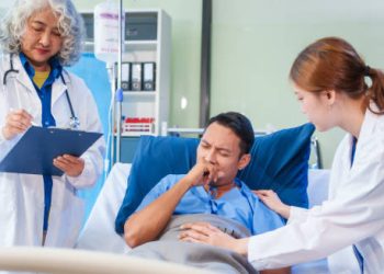 Hospitalised patient receiving care for epiglottitis from medical staff