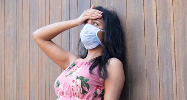 Woman in mask experiencing symptoms possibly linked to Group B Strep