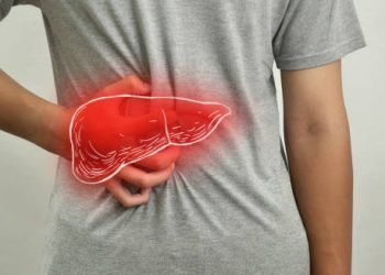 Person clutching back near liver area with digital liver overlay