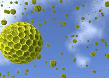 3D render of airborne pollen particles floating in a blue sky, causing hay fever