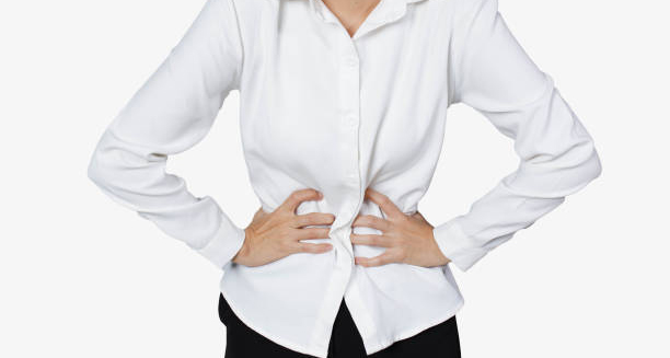 Woman clutching her stomach due to complications from gastroparesis