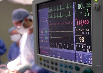 Cardiac monitor displaying vital signs during heart surgery, indicating severe heart complications