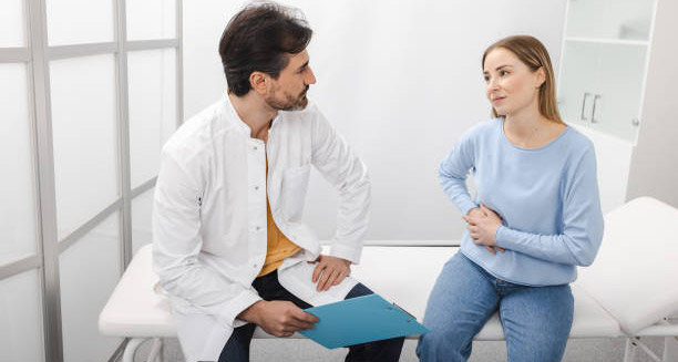 Doctor discussing liver complications of Hepatitis B with a female patien