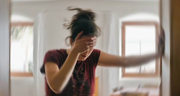 Woman experiencing dizziness due to severe hypoglycaemia