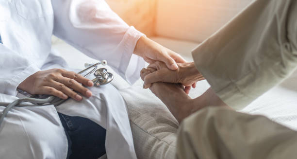 Doctor examining patient’s foot during a medical consultation