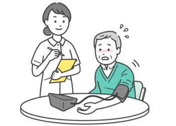 Nurse checking blood pressure of elderly man showing signs of hypotension