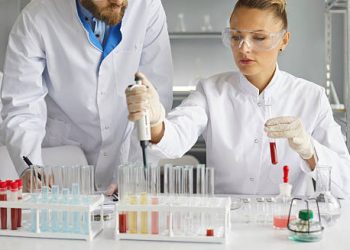 Medical scientists performing laboratory tests for Isovaleric Acidaemia diagnosis