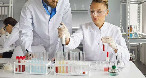 Medical scientists performing laboratory tests for Isovaleric Acidaemia diagnosis