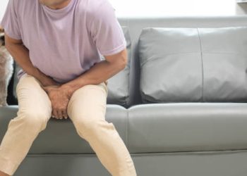 Child with rubella rash on chest being examined for complications