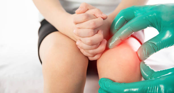 Child experiencing growing pains being examined for knee discomfort