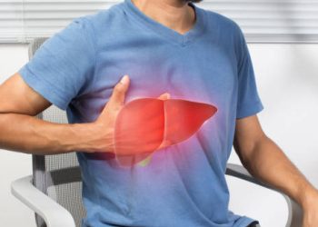 Man holding chest with liver illustration, indicating possible iron overload