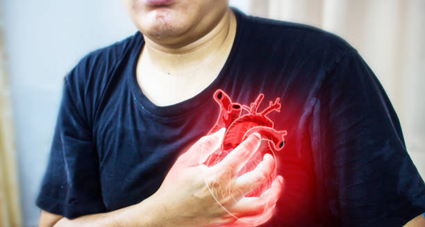 Man clutching chest in severe pain with digital heart illustration glowing red