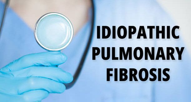 Medical professional holding stethoscope next to text reading Idiopathic Pulmonary Fibrosis