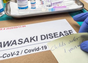 Medical dossier labelled Kawasaki Disease linked to Covid-19 with treatment vials and handwritten note